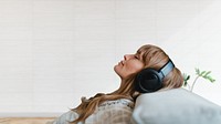 Woman listening to music at home during coronavirus pandemic