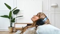 Woman listening to music at home during coronavirus pandemic