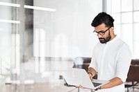 Indian man working on laptop