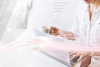 Businesswoman drinking coffee while working at home