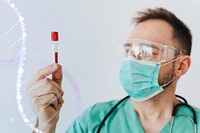 Surgeon wearing a mask holding a test tube