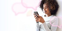 Smiling woman using a smartphone texting