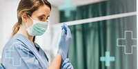 Female nurse with a mask putting on gloves