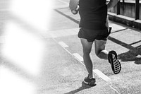 Person jogging at park black and white