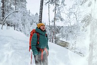 Woman trekking through a snow covered Lapland, Finland
