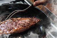 Chef cooking steak in a pan food photography recipe idea