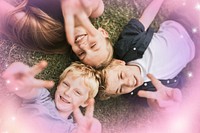 Kids lying on a grass, family photo