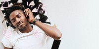 Black man with headphones listening to music remix