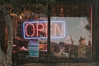 Neon open sign in the window of a restaurant remix