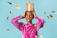 Happy black woman holding a gift box