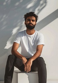 Indian wearing white t shirt mockup clothing sitting apparel.