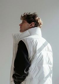 A man wearing a white puffer vest mockup photography clothing portrait.