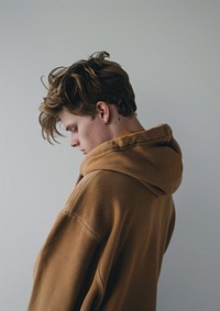 A man wearing a brown hoodie photography portrait clothing.