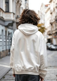 Young man wears blank white hoodie mockup sweatshirt clothing knitwear.