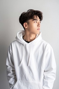 Young man wears blank white hoodie mockup face sweatshirt clothing.