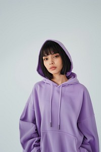 Young woman wears blank purple hoodie mockup sweatshirt clothing knitwear.