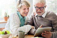 Senior couple using a tablet