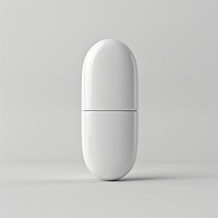 Powdered oval white pill with center line electronics medication porcelain.