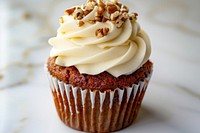 Carrot cake cupcake with a cream cheese frosting dessert creme food.