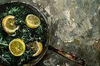 Close up on pale skillet kale with lemon and garlic vegetable cookware machine.