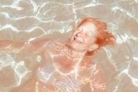 Elderly women laughing and swimming people happy pool photography recreation portrait.