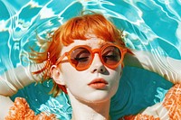 Women lying down in the sun wearing sunglasses on the pool photo accessories photography.