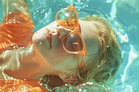 Women lying down in the sun wearing glasses on the pool accessories recreation sunglasses.