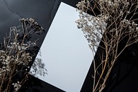 Closeup photo of a blank a4 paper mockup flower architecture building.
