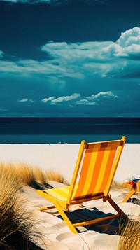 Photo of summer beach furniture shoreline outdoors.