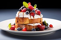 A French toast with berries and cream on top blueberry brunch plate.