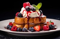A French toast with berries and cream on top brunch plate berry.