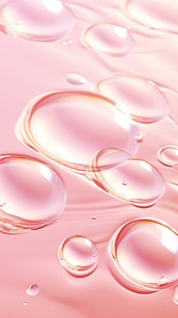 A pink background with water ripples medication blossom droplet.