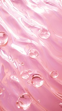 A pink background with water ripples blossom droplet flower.