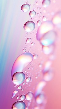 A rainbow pastel background with water ripples droplet plant leaf.