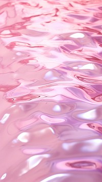 A pink background with water ripples blossom flower purple.