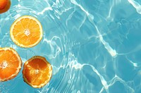 Summer background orange fruit water.