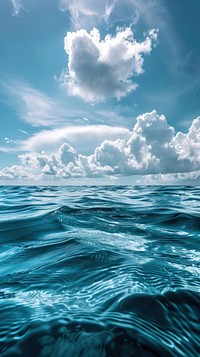Blue sea ocean water surface and underwater with sunny and cloudy sky landscape outdoors scenery.
