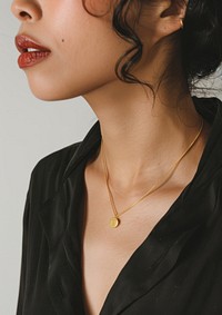 A gold necklace woman accessories accessory.