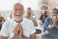 Smiling old man in yoga class