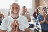 Smiling old man in yoga class