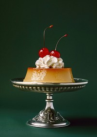 An old-fashioned flan with whipped cream and a cherry on top food cheesecake dessert.