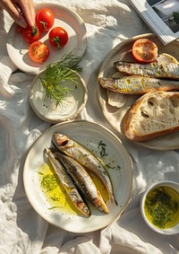 One featuring sardines and the other having baguette bread on it plate dish herring.