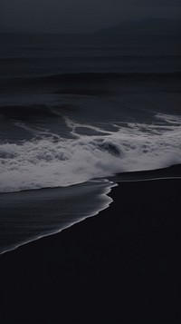 Black beach shoreline outdoors scenery.