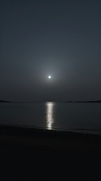 Moon horizon night beach.