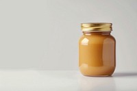 Glass jar with caramel sauce