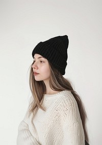 Woman wearing black knit beanie