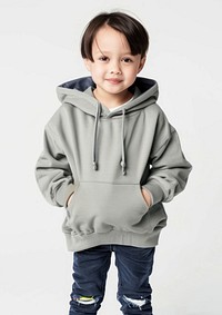 Child wearing grey hoodie