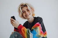 Smiling person holding smartphone