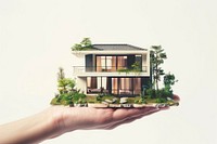 Miniature modern house in hand