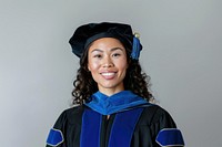 Smiling graduate in academic regalia